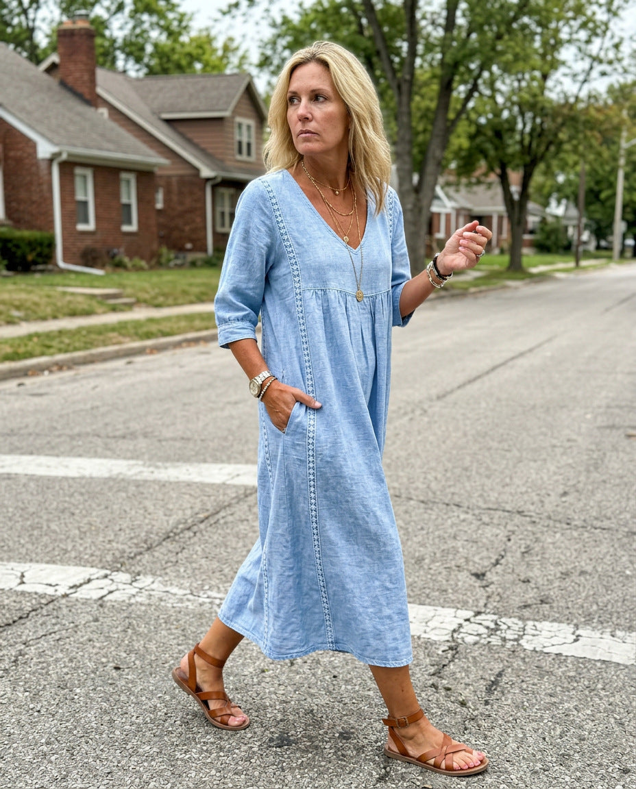 Woman wearing the Inès Dress in light blue